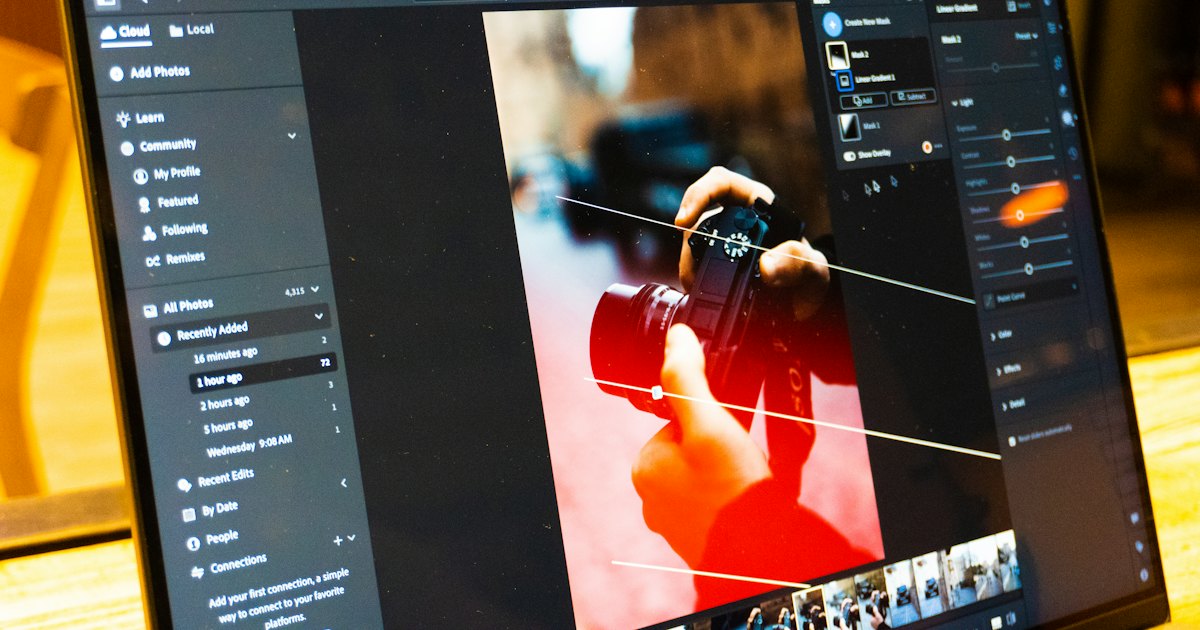 A laptop screen showing photo editing software with a portrait open and adjustment panels visible