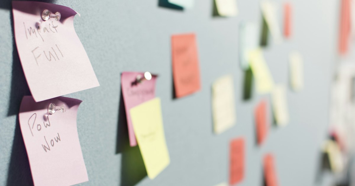 Colorful sticky notes pinned to a board, used for planning and brainstorming