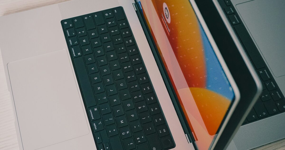 Two laptops placed side by side on a table