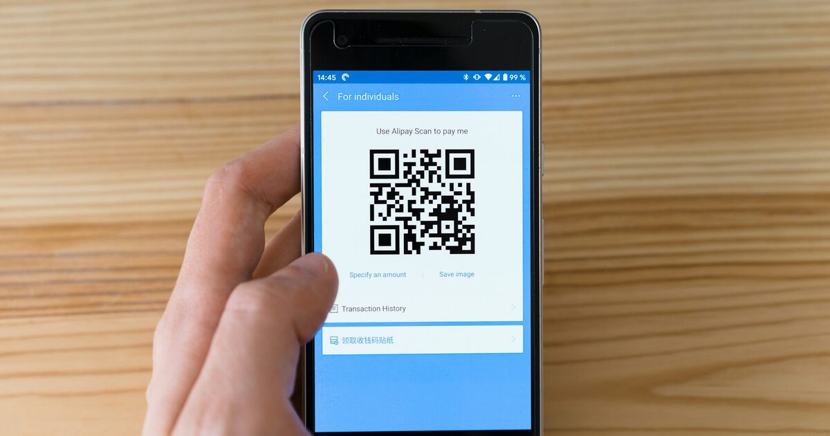 A black Android smartphone displaying a QR code on its screen